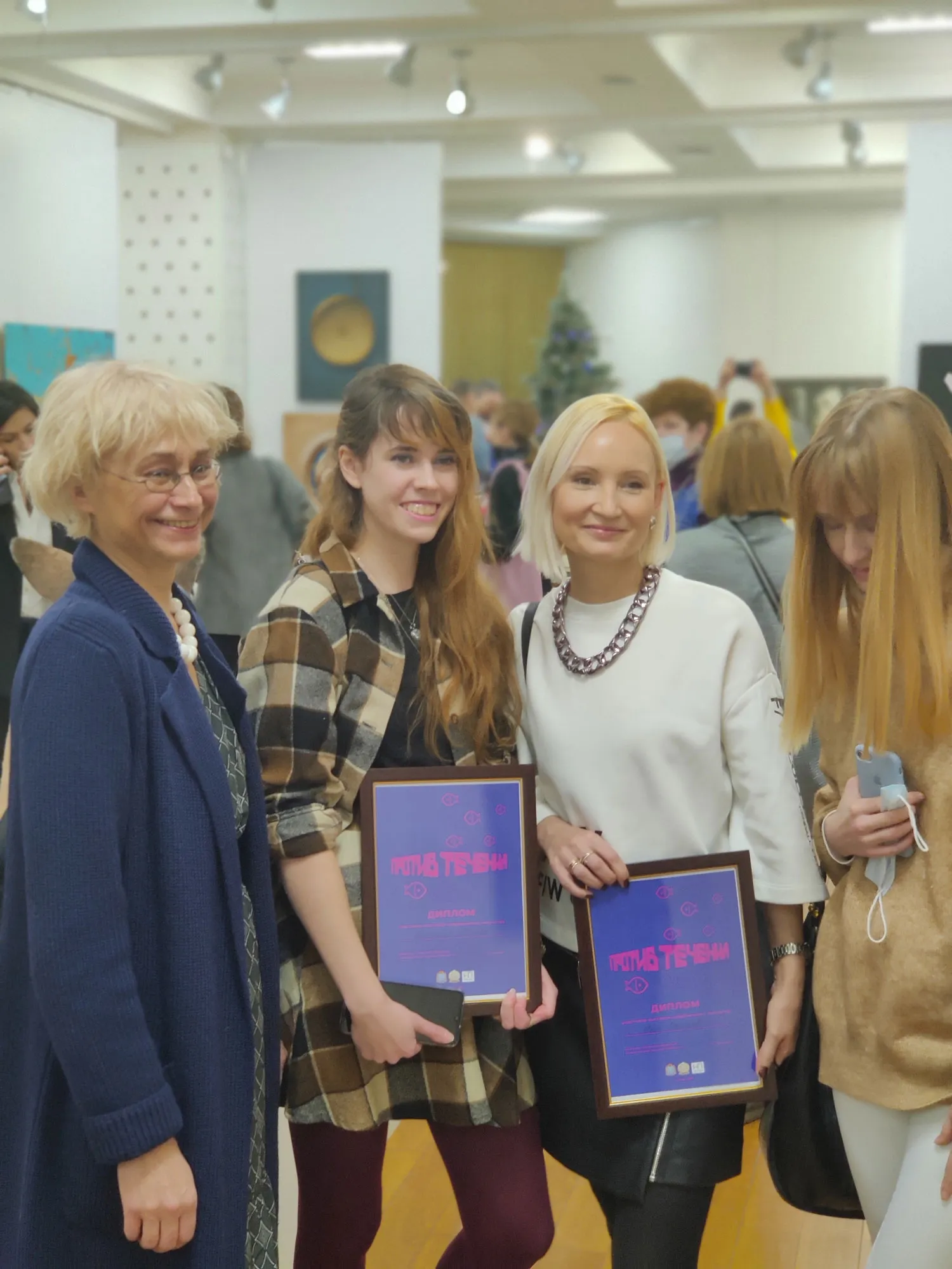 Oksana Stogova, Anastasia Ivanova, Yulia Latysheva at the exhibition 'Against the Current' in the New Space gallery, Samara, Russia